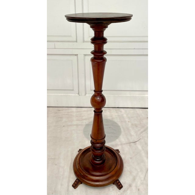 Here is a wonderful, stand made of solid wood (I believe mahogany) that has many special design details which sets it...