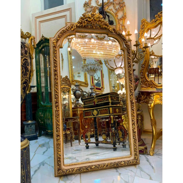 Make an unforgettable statement with this magnificent French Rococo floor mirror, exquisitely crafted with an ornate frame...