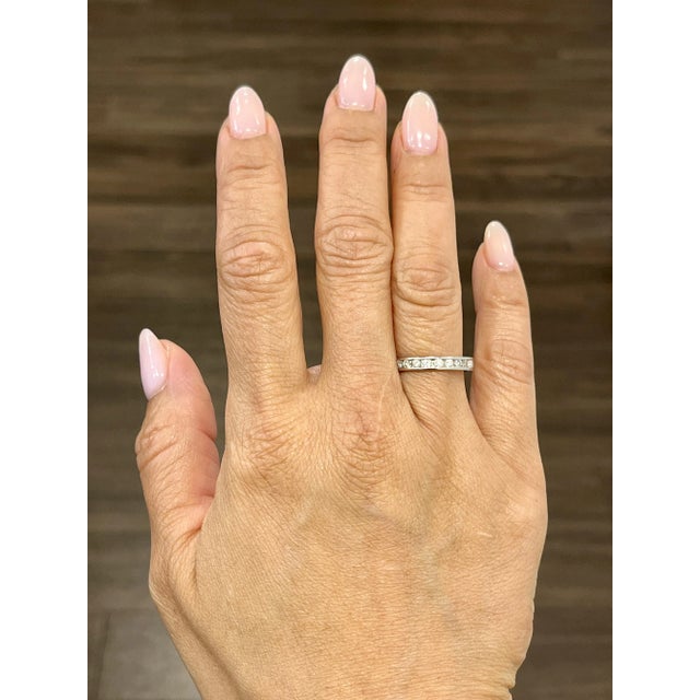 This gorgeous channel set ring features 23 round brilliant diamonds. Approximately 1.25 ct, the diamonds boast a color of...