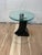 A striking Postmodern sculptural side table dating from the late 1980s to early 1990s, featuring a dramatic architectural...