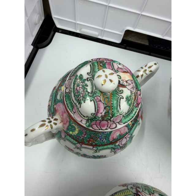 This Antique Chinese Famille Rose Medallion Porcelain Tea Set is a timeless treasure originating from Canton, China during...