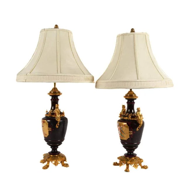 This captivating Pair of Continental Table Lamps blends classical drama with luxurious detail. Each lamp is anchored by an...