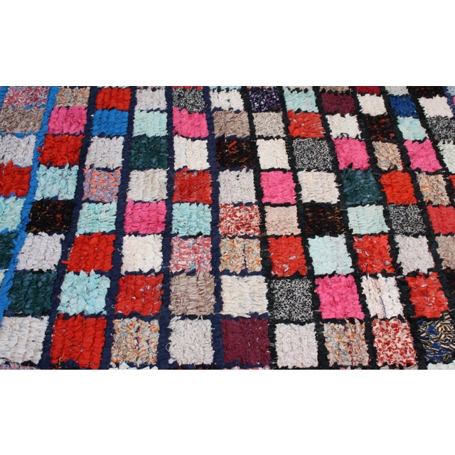 The Berbers created the first boucherouite rugs in the 20th century, weaving cotton, fabrics and wool into vivid patterns....
