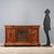 Neo-Baroque walnut sideboard. Split front with a projecting central element, including a leaded stained-glass door and...