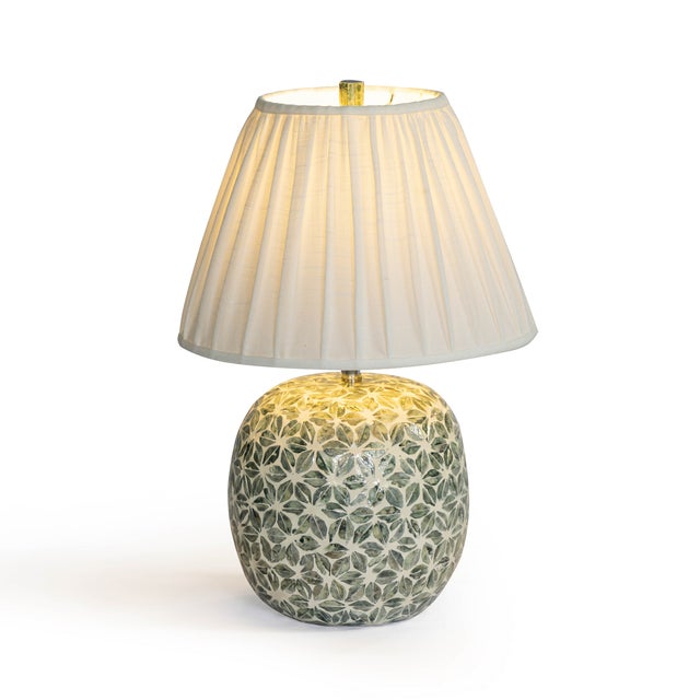 The Yaya Table Lamp turns everyday lighting into a statement. The hand-painted base ensure every piece is completely...