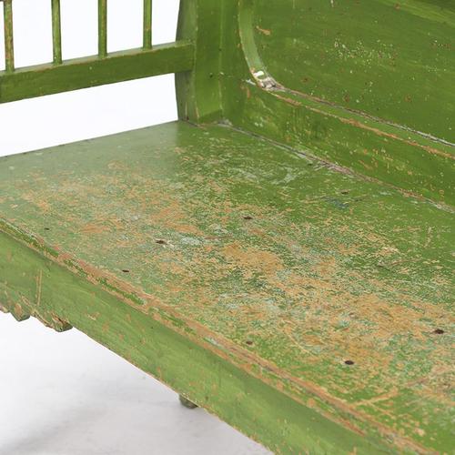 A charming Hungarian bench from the 1920s with a distinctive rustic look. The bench is painted in a fresh green color,...