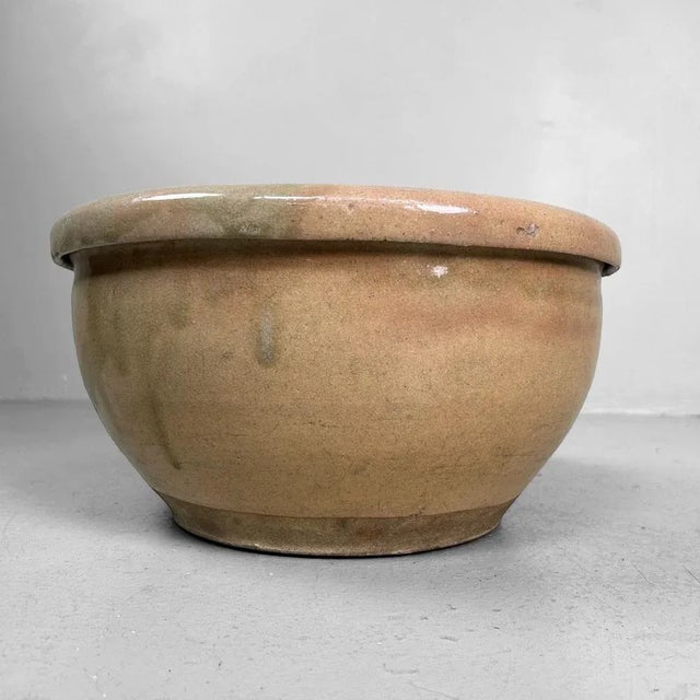 This robust earthenware bowl from Japan dates back to the Meiji period (1868–1912) and belongs to the mingei tradition,...