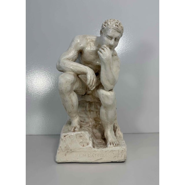 Elegant sculpture depicting "The Thinker", produced in Italy during the 1950s and inspired by Auguste Rodin's iconic...