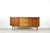 Teak sideboard Standing on an elegantly designed walnut frame, this capacious sideboard has two large compartments with...