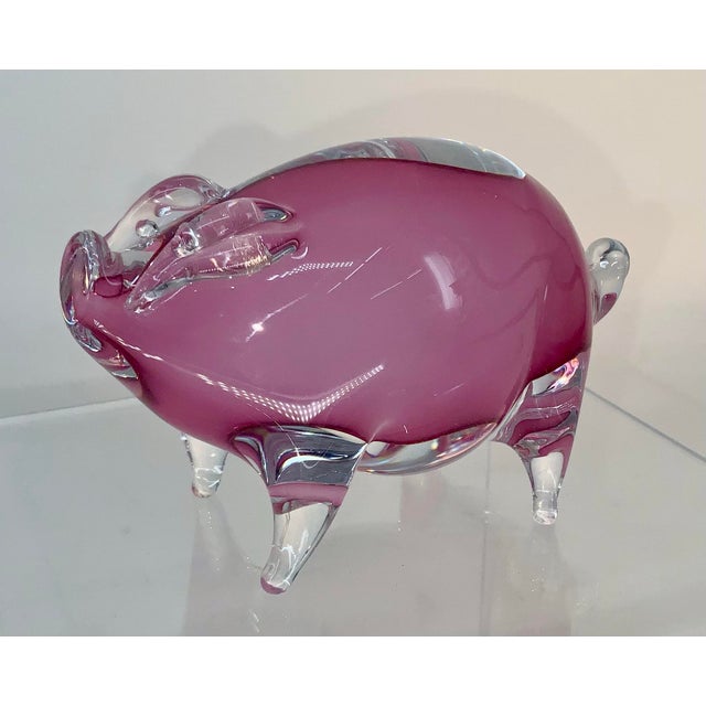 Handcrafted clear and pink glass figurine of an adorable pig. Artist signature on the belly.