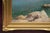 The painting depicts a view of the island of Capri; on the left lies a calm, crystal-clear sea, while on the right an...