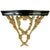 A striking pair of Neoclassical style wall console brackets featuring an elegant contrast of solid cast brass foliage and...