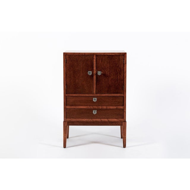 This lovely little vintage Scandinavian Art Deco wood side cabinet or nightstand was made in Denmark circa 1950. This...
