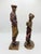 A charming pair of vintage 1989 Austin Productions golfer sculptures featuring a distinguished gentleman and elegantly...
