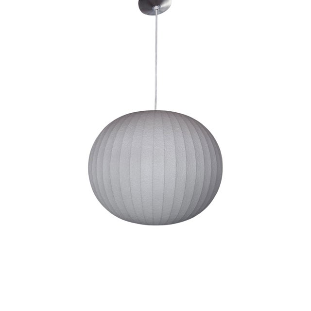 A beautifully made example of one of mid-century modernism's most enduring icons. This medium Ball Bubble Pendant was...