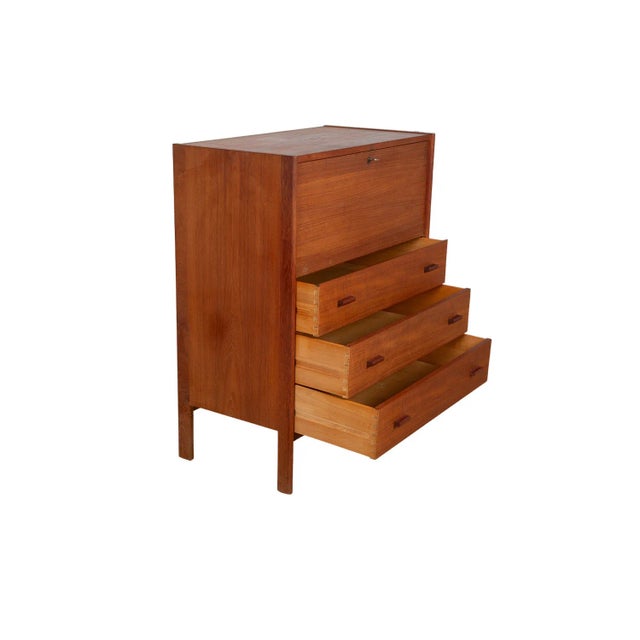 An elegant Mid-Century Modern teak secretary desk or vanity with mirror. Featuring beautifully grained teak wood case and...