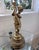 Dramatic oversized vintage Hollywood Regency table lamp featuring a beautifully sculpted cherub figure surrounded by...