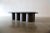 A contemporary coffee table designed by Philip Goold of Virginia Beach. A solid white oak top with a dark chocolate...