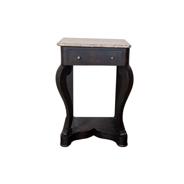 Marble top side table with scroll front supports. Dark finish with red undertones. Paw feet. France Circa 1850