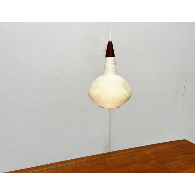 Simple Rotaflex pendulum based on a design by Yasha Heifetz from the 1960s. Minimalist pendant lamp made of plastic and...