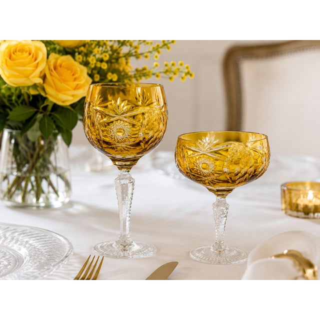 A magnificent 24-piece cut crystal reception service by Nachtmann, perfectly coordinated. Crafted from stunning amber-...