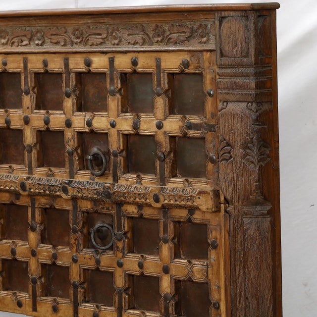 Once part of a historic Indian home, this teakwood door has been reimagined as a striking queen-size headboard. Its carved...