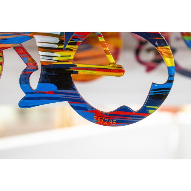 This vibrant metal wall sculpture by David Gerstein exemplifies the artist’s celebrated pop-art style and masterful use of...