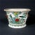 A beautiful small Chinese porcelain planter or flower pot in the shape of a fish bowl but much smaller in size. Decorated...