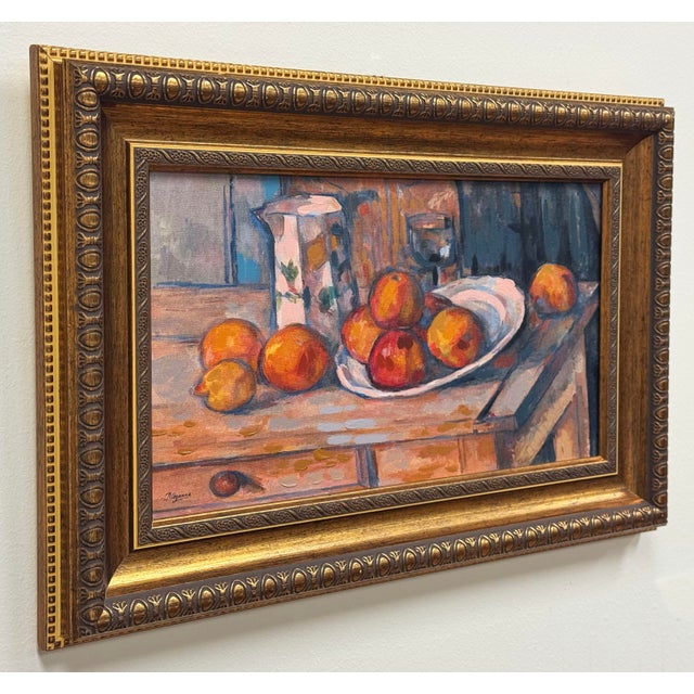 Gold framed "Still Life with Milk Jug and Fruit" reproduction on canvas after post-impressionist artist Paul Cezanne. This...