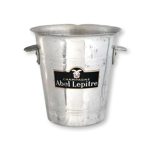 This unusual vintage French champagne bucket features two different Champagne house labels, Abel Lepitre and A. de Bourbon...