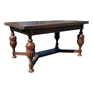 Early 20th Century Jacobean Revival Carved Oak Draw-Leaf Dining Table For Sale