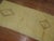 A vintage Turkish shag pile runner in yellow and soft brown 2'10'' x 9'8''