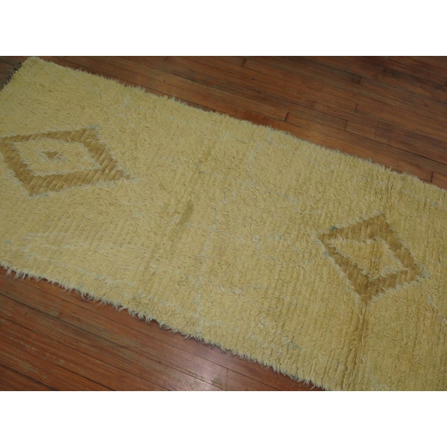 A vintage Turkish shag pile runner in yellow and soft brown 2'10'' x 9'8''