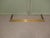 19th Century Brass Fender This is an elegant Brass fender with a stepped edge and hand beaten decoration, the fender is in...