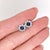 Make a statement with these deep royal-blue Sapphire stud earrings, set in solid 14K White Gold. Each earring centers a...