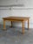 Danish draw leaf dining table designed by Henning Kjærnulf and crafted in solid oak. This elegant Scandinavian table...