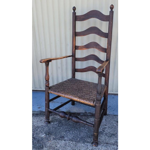 18Thc Hudson River Valley ladder back chair with original woven seat.This fine ladder back arm chair has a wonderful aged...