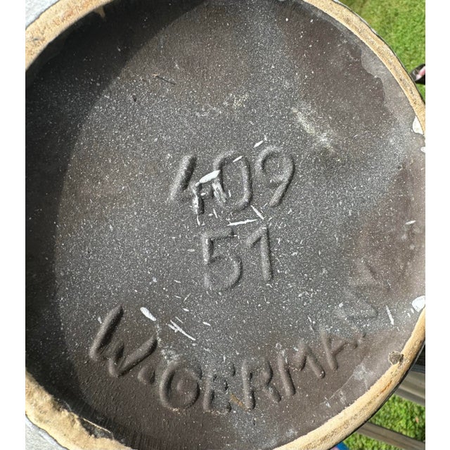 Large floor vase with geometric mid century modern design and large handle.