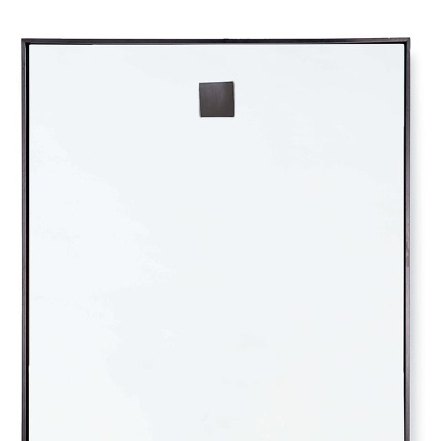 Add reflective, contemporary edge to any room with this understated yet sleek, rectangular hanging mirror.
