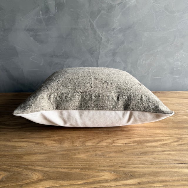 Hemp rug pillow with original seams. Soft hand, linen blend backing with zipper closure. Spot cleaning is recommended, or...