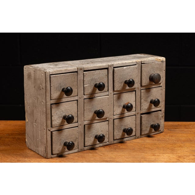 Handpicked by IndustrialArtifact Vintage from the 1930s About this item A small tabletop parts cabinet for the storage of...