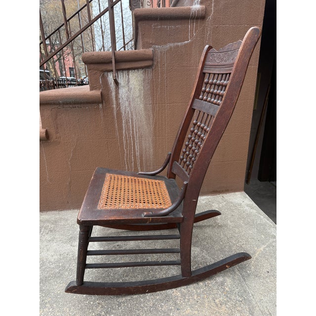 Early 20th/Late 19th Century Victorian Rocking Chair With Spindle Back and Cane Seat For Sale - Image 4 of 12