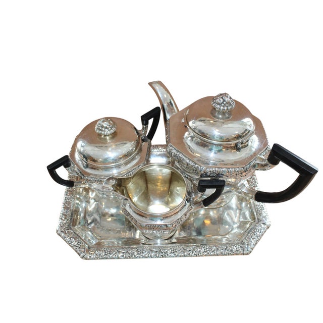 Antique art deco silver tea service by Laurits Berth(1857-1917). Teapot (h.19cm;l.27cm;w.14cm;v.1.6 l), milk...