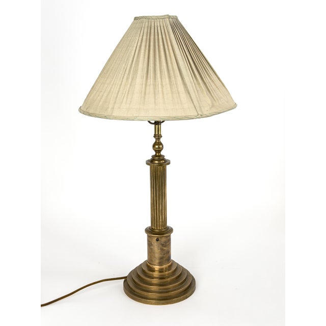 Produced by the historic Swedish brass foundry Skultuna during the 1940s, this exceptional table lamp embodies the...
