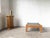 Modernist coffee table from the 1970s, crafted from solid pine with a square top, reminiscent of the mountain furniture of...