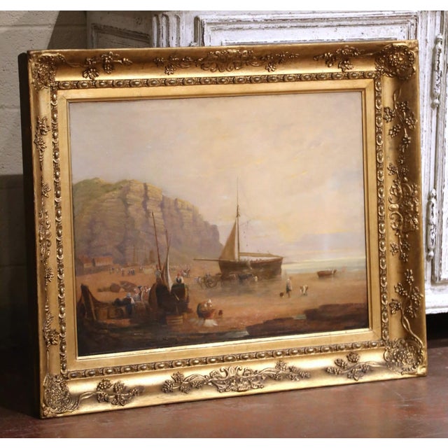This atmospheric antique coastal painting was crafted in England circa 1860 and captures the daily rhythm of a Victorian...