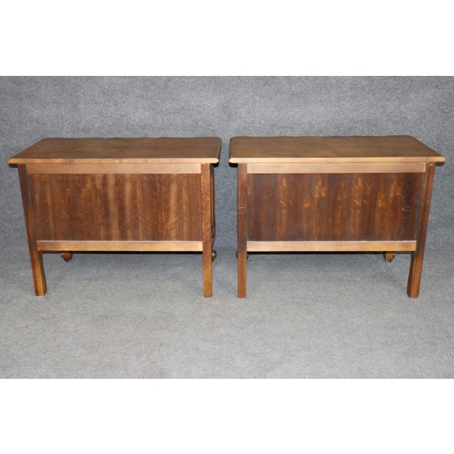 An exceptionally handsome pair of E.J. Victor Louis XIV-style commodes, beautifully executed with richly figured veneers,...