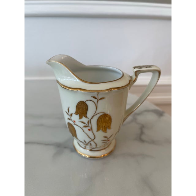 Collectors item rare antique set of 5 expresso cups and saucers plus sugar and creamer. Rare pattern of gold bell flowers...