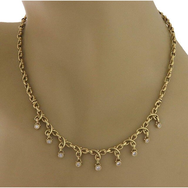 This lovely necklace is by Judith Ripka, it is crafted from 18k yellow gold featuring chasing S links chain with a lobster...