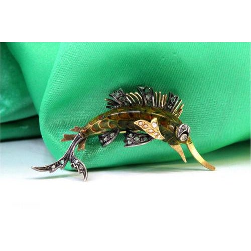 Gold and Silver Brooch with Diamond Flakes and Enamel, in Very Good conditions. Designed 1920 to 1949 This piece has an...